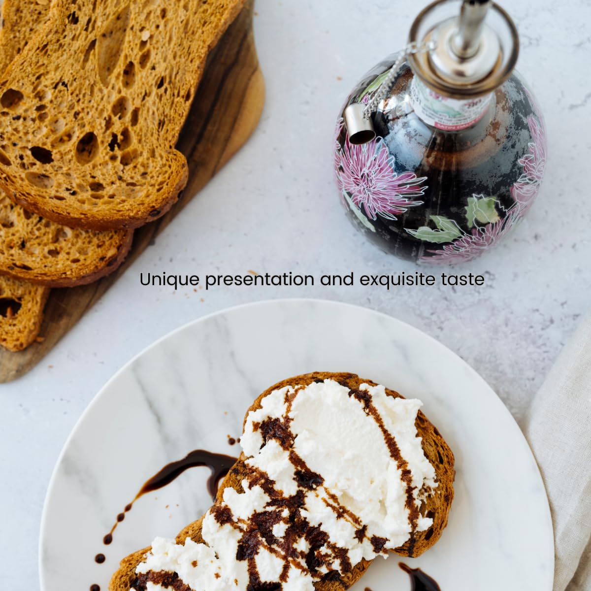 Toast with cream and a bottle of syrup on a marble surface