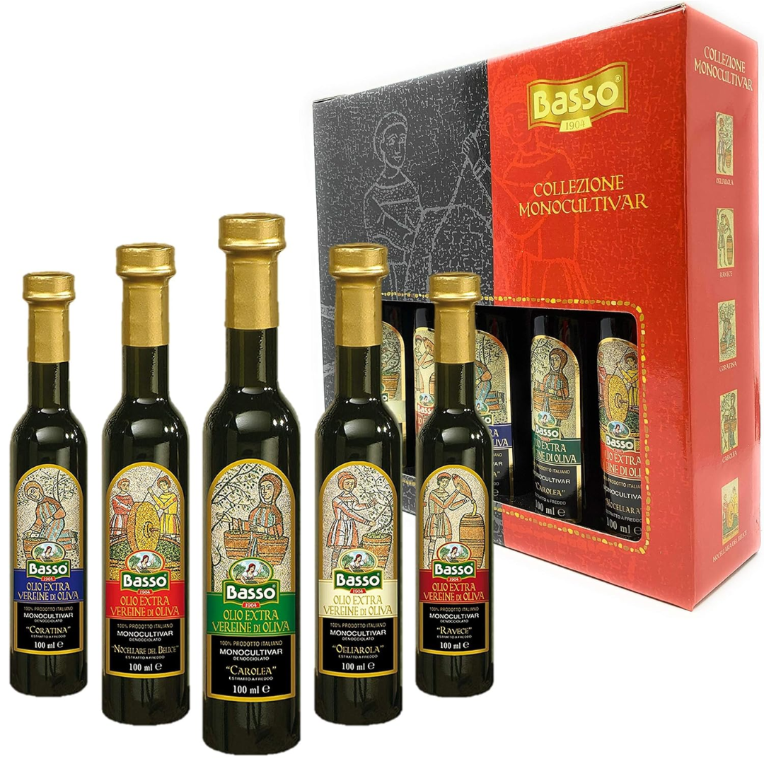 A set of five Basso 1904 Extra Virgin Olive Oil bottles in a gift pack with unique labels for each variety, displayed in front of a red box with the Basso logo.