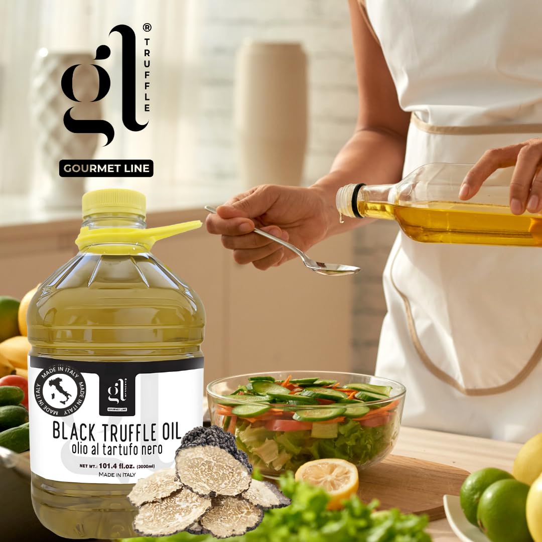 Chef preparing fresh salad with GL Black Truffle Oil 3L, bulk Italian truffle oil for gourmet kitchens and restaurants