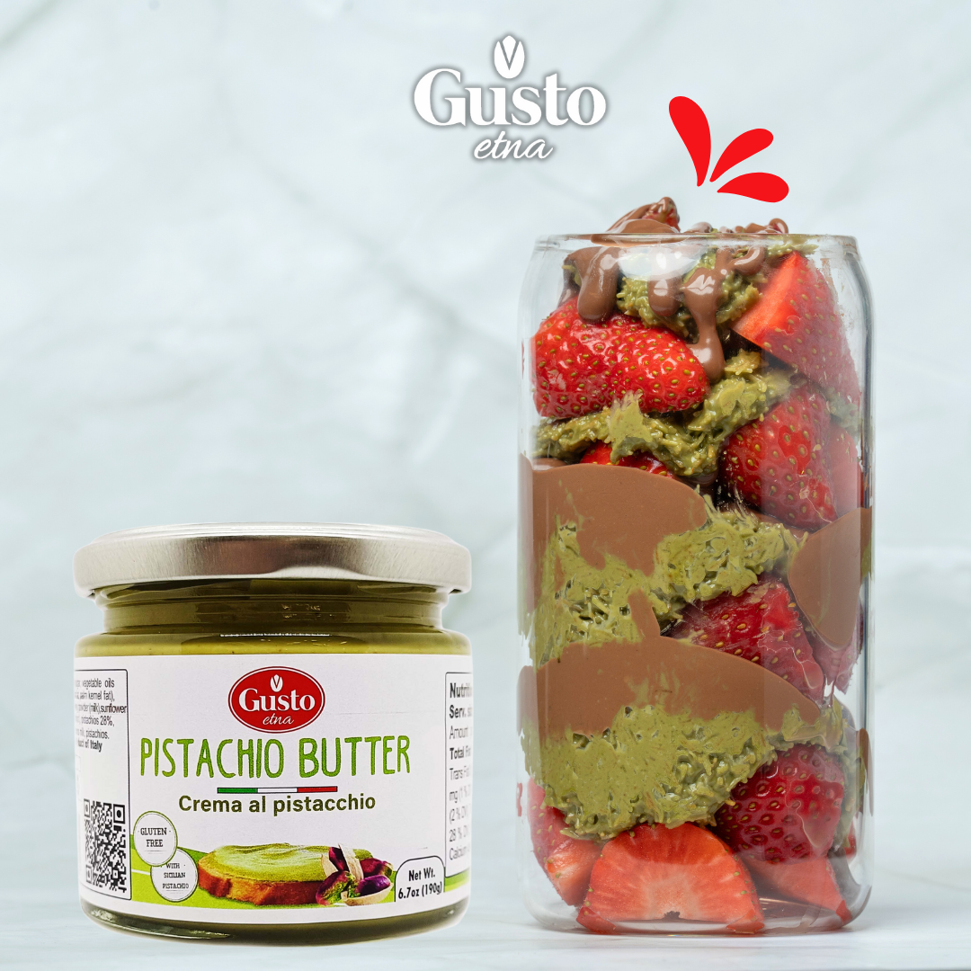 Gusto Etna Pistachio Butter with a dessert jar layered with fresh strawberries, pistachio cream, and chocolate.