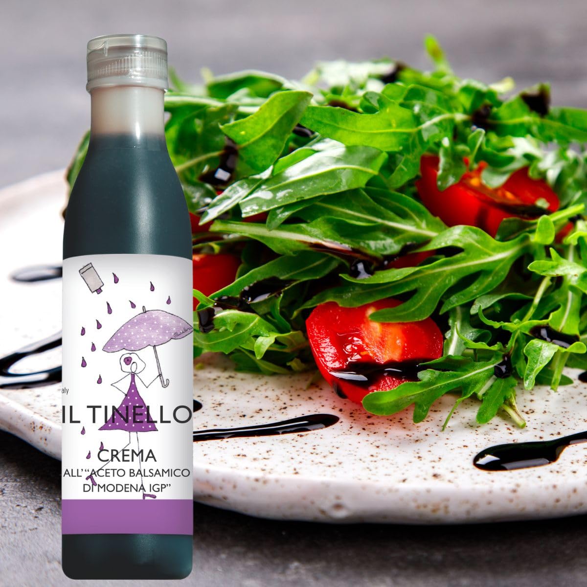 Bottle of Il TineLlo Crema with a salad in the background