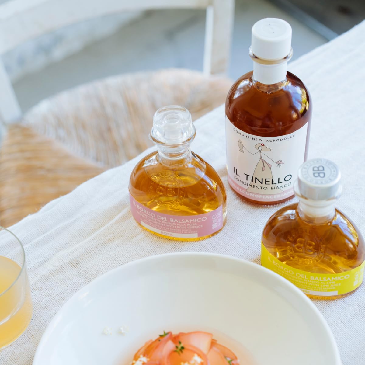 Three bottles ofulta products on a table with a bowl and glass.