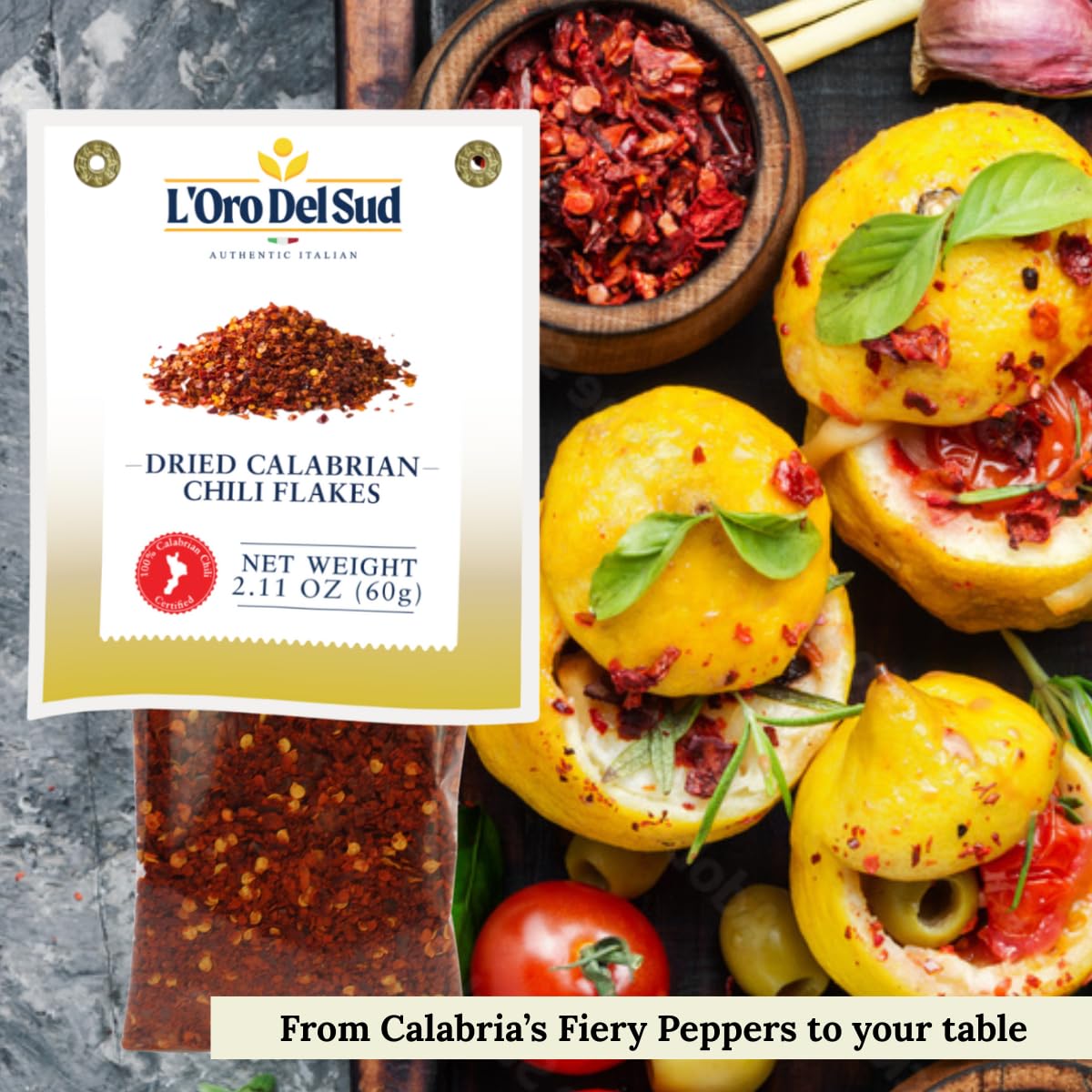 L'Oro Del Sud dried calabrian chili flakes packaging with food items on a dark surface