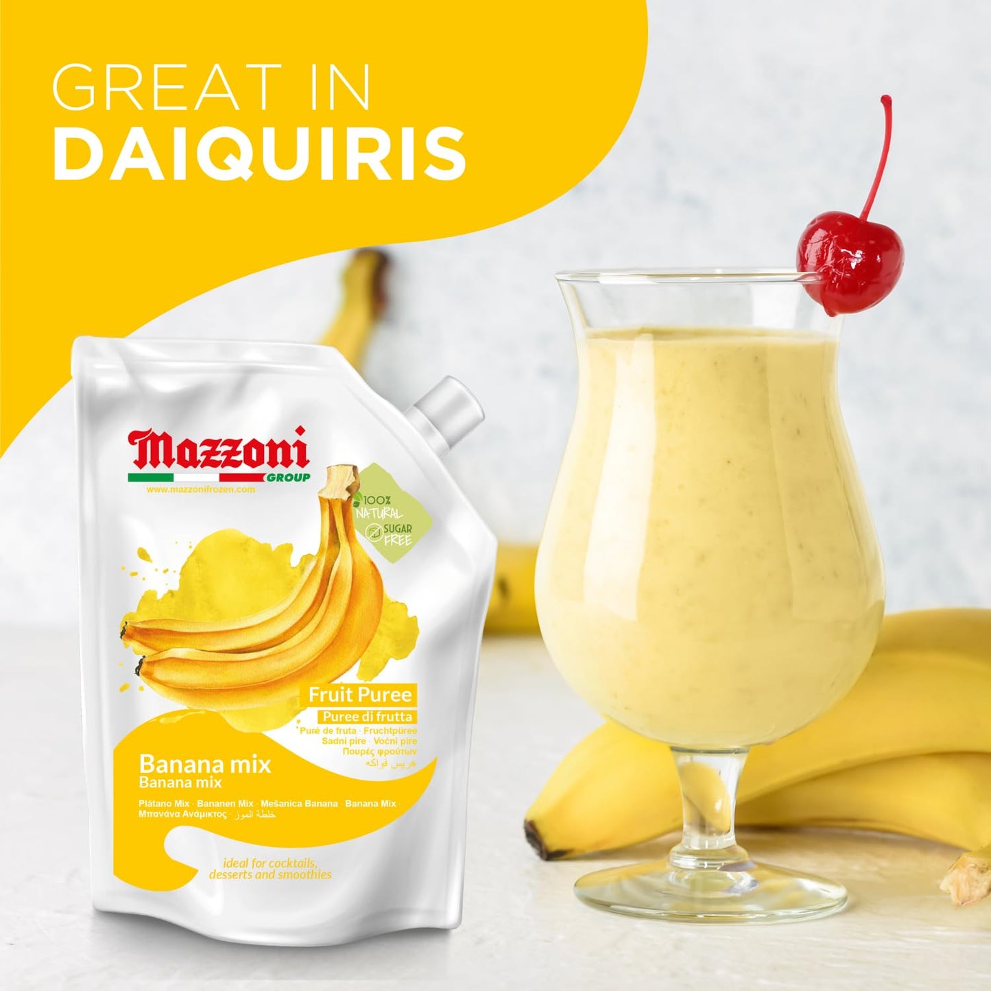 Mazzoni banana mix fruit puree package with a glass of banana smoothie and cherry on top.
