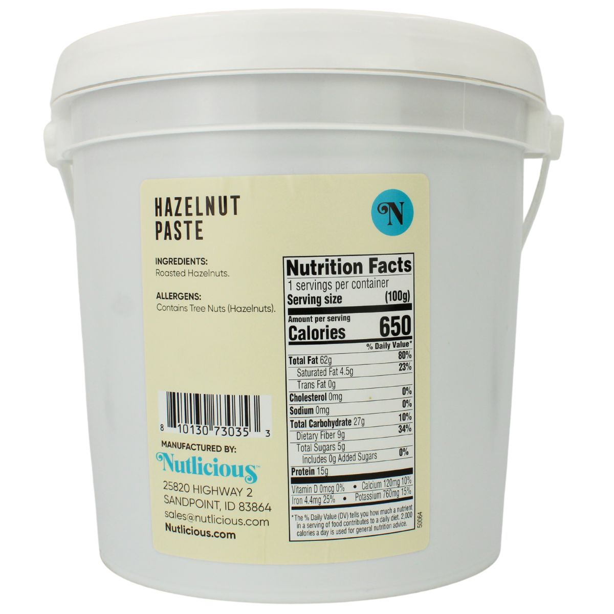 White container of hazelnut paste with a label showing nutrition facts and ingredients.