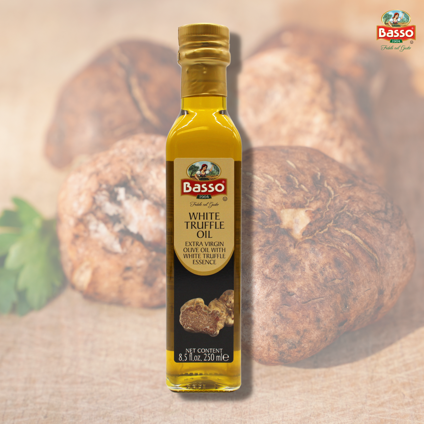 Basso 1904 White Truffle Infused Extra Virgin Olive Oil 8.5 fl oz (250 ml) bottle displayed with whole white truffles in the background