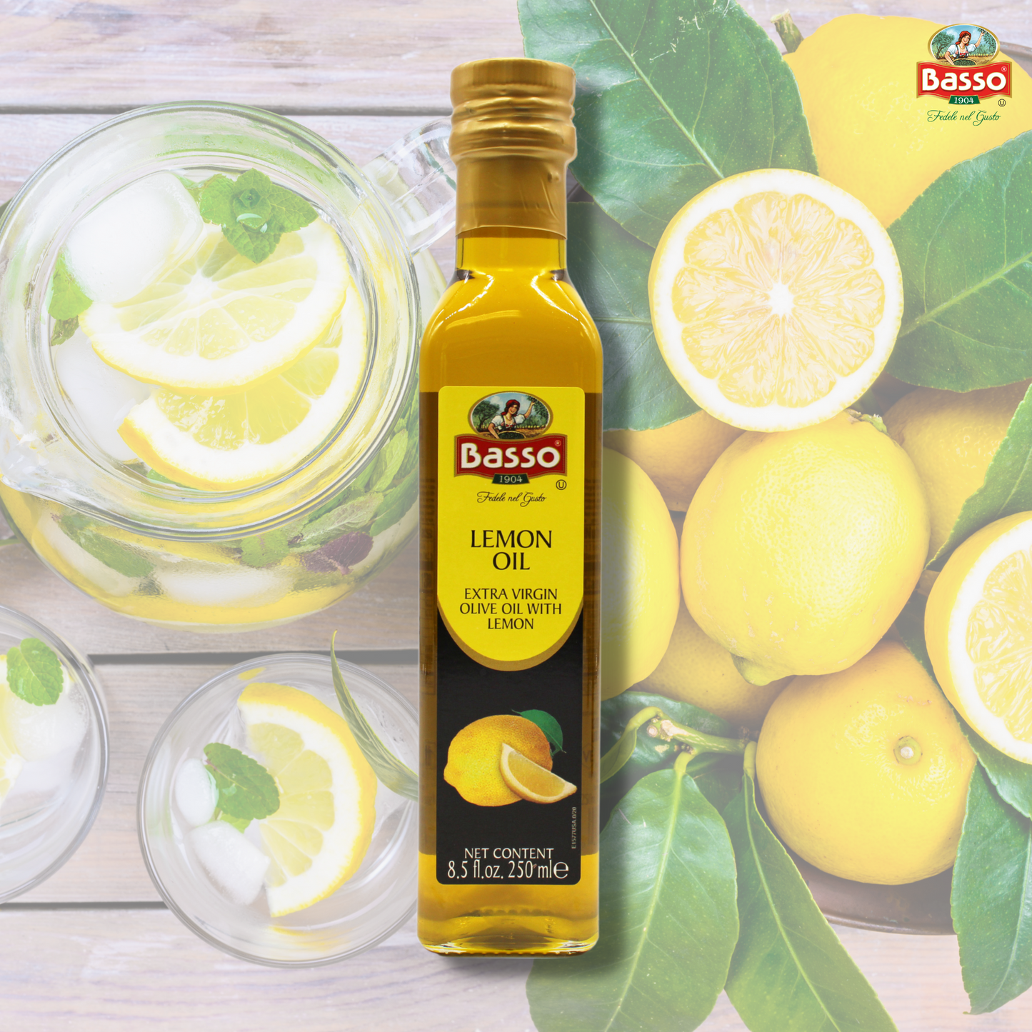 Basso 1904 Lemon Infused Extra Virgin Olive Oil 8.5 fl oz (250 ml) bottle displayed with fresh lemons, lemon slices, and a jug of lemon water in the background