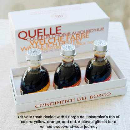 Three bottles of Balsamic vinegar in a box with 'Quelle' branding on a light background.