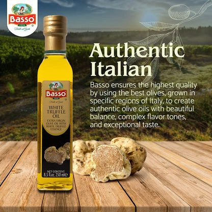 Bottle of Basso White Truffle Extra Virgin Olive Oil on wooden table with fresh white truffles, featuring text about authentic Italian quality and flavor crafted from the best olives.