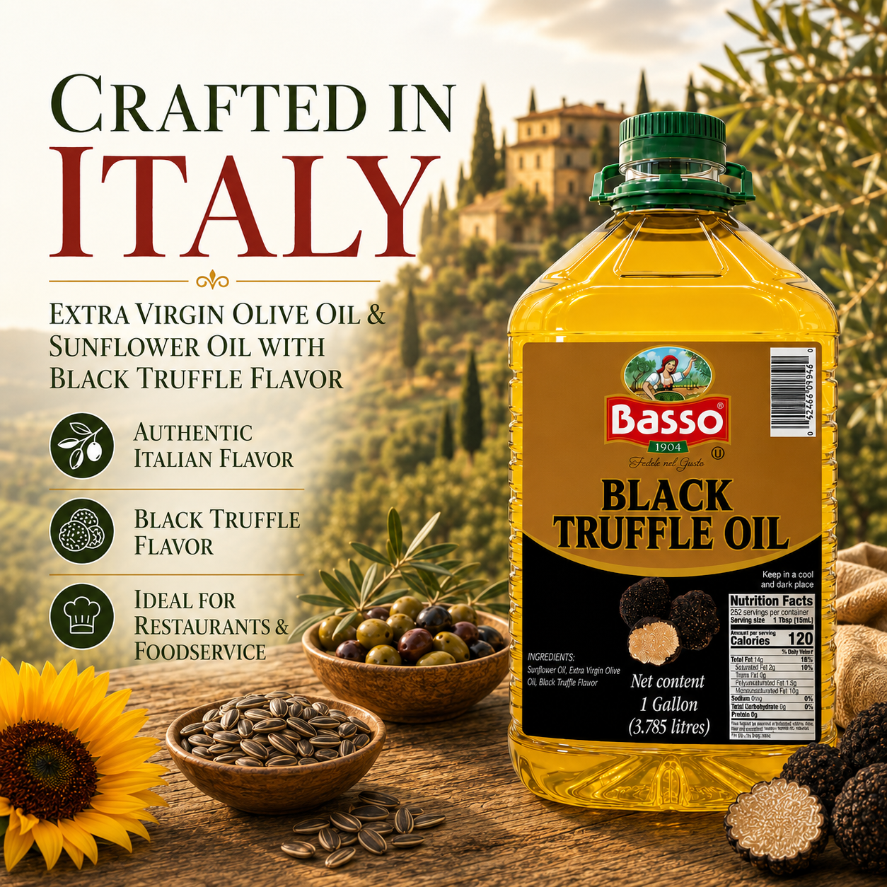 A 1 gallon bottle of Basso Rosso Black Truffle flavored extra virgin olive oil and sunflower oil, displayed on a rustic wooden table with bowls of olives, sunflower seeds, and black truffles, alongside a scenic Italian landscape background and 'Crafted in Italy' text.