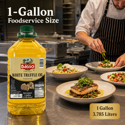 A 1-gallon bottle of Basso White Truffle Oil is shown in a professional kitchen setting next to plated cooked food, with text overlays indicating '1-Gallon Foodservice Size' and '1 Gallon 3.785 Liters'.