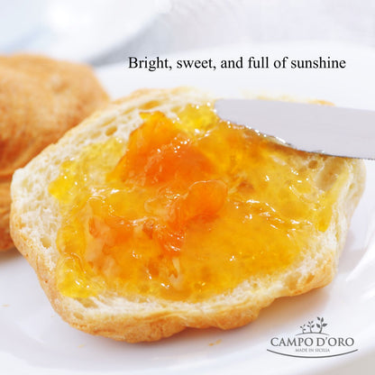 Bread slice with yellow jam being spread, with 'Campo d'Oro' branding.