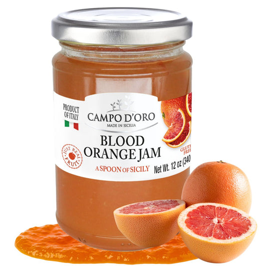 Jar of Campo d'Oro Blood Orange Jam with blood oranges on a white background