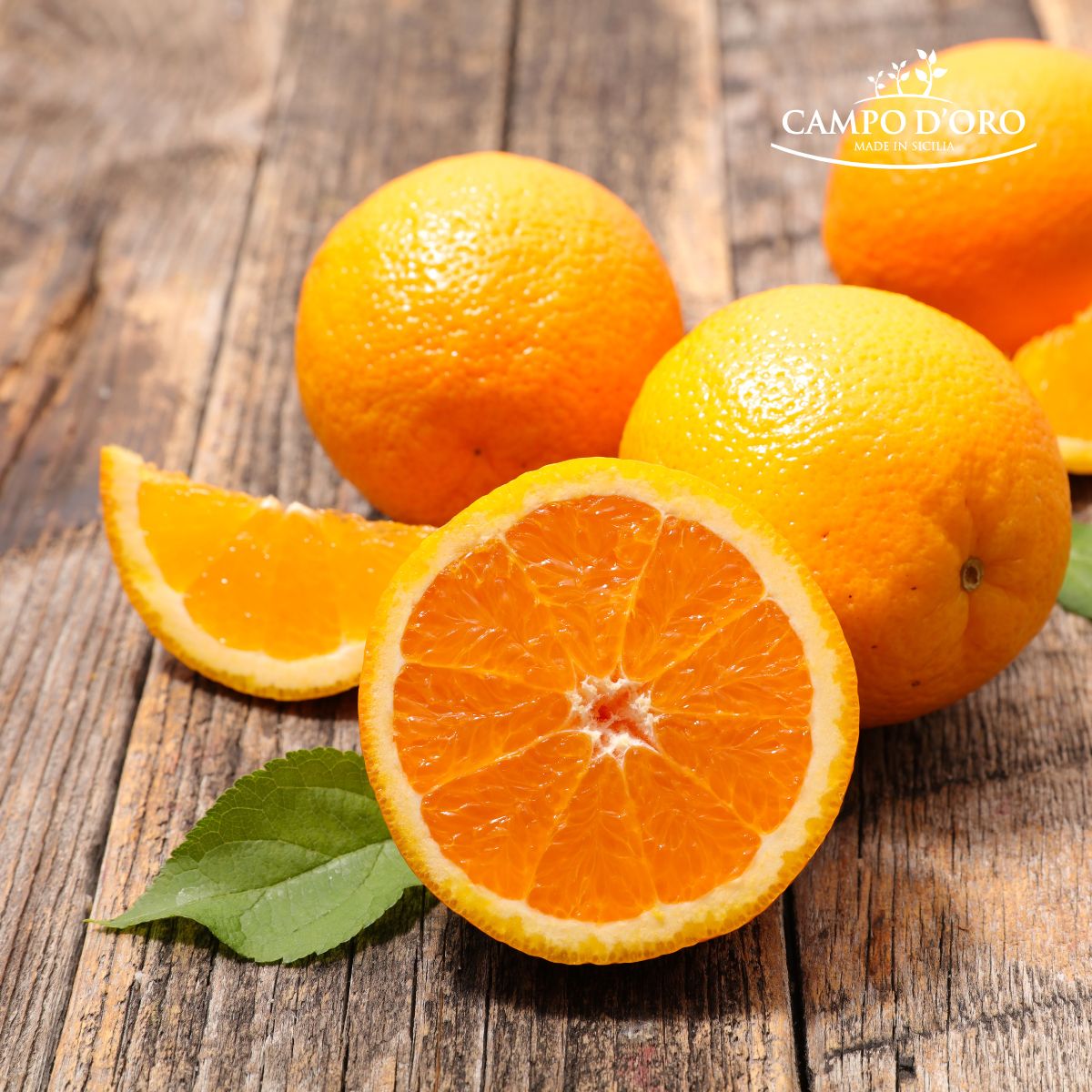 Oranges on a wooden surface with 'Campo D'Oro' branding.
