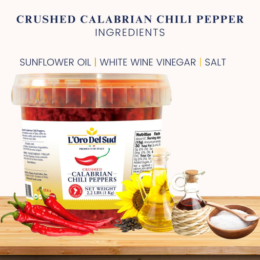 Ingredients for crushed Calabrian chili pepper with L'Oro Del Sud container on a wooden surface.