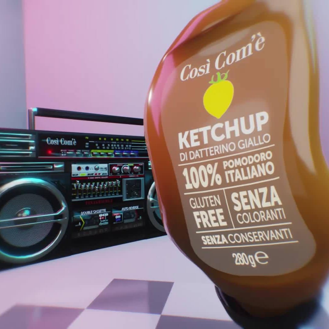 Close-up of Così Com’è Yellow Datterino Tomato Ketchup (280 g) bottle, labeled gluten-free, with no preservatives or artificial colors, placed in front of a retro-style boombox with colorful lighting.