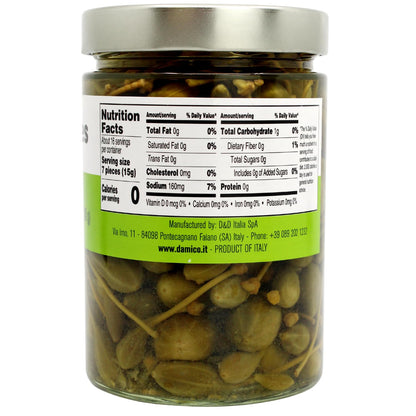 Fratelli D’Amico Caperberries in vinegar in a 19 oz (540 g) glass jar with a drained weight of 8.5 oz (240 g), displayed alongside assorted cheeses, crackers, and figs on a table setting.