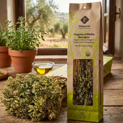 Packaged oregano with fresh oregano and olive oil on a wooden table.