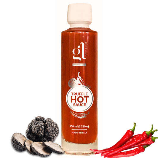 A bottle of gourmet hot sauce labeled 'Truffle Hot Sauce' with images of chili peppers and black truffles, and the text '100 ml (3.3 fl oz) Made in Italy.