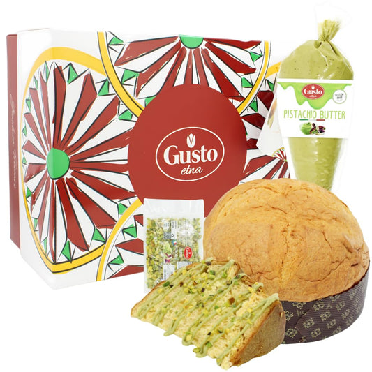 Gusto Etna Pistachio Panettone gift set, featuring a large artisanal panettone, piping bag filled with creamy pistachio butter, packet of chopped pistachios, and decorative gift box with a colorful Sicilian-inspired design