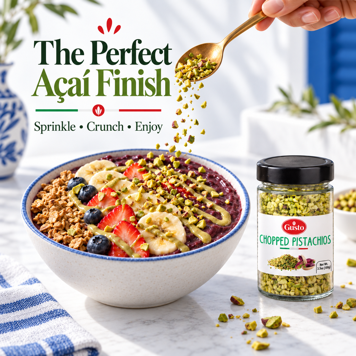 A jar of Caisto Chopped Pistachios shown next to a styled açaí bowl with banana, berries, granola, and drizzles, with a hand sprinkling more pistachios. Promotional text reads 'The Perfect Acai Finish'.