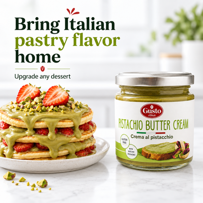 A jar of Gusto Etna Pistachio Butter Cream sits next to a tall stack of strawberry pancakes with green pistachio sauce and chopped pistachios, on a white plate. The background is a bright, blurred kitchen setting with Italian text overlay that reads 'Bring Italian pastry flavor home'.