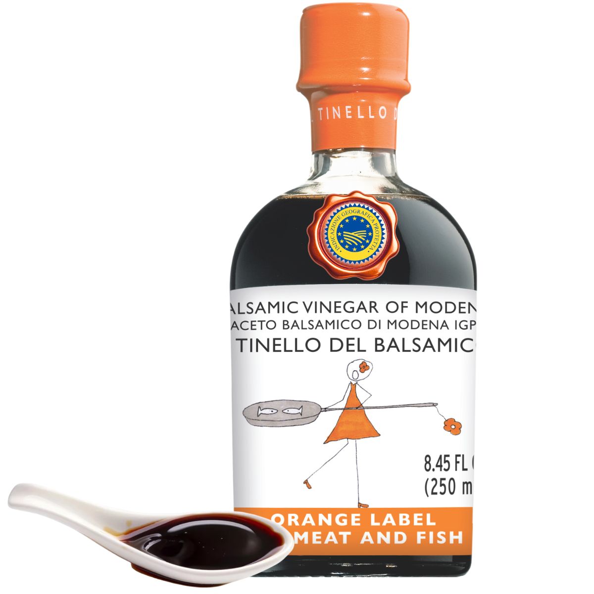 Bottle of balsamic vinegar with a orange label on a white background