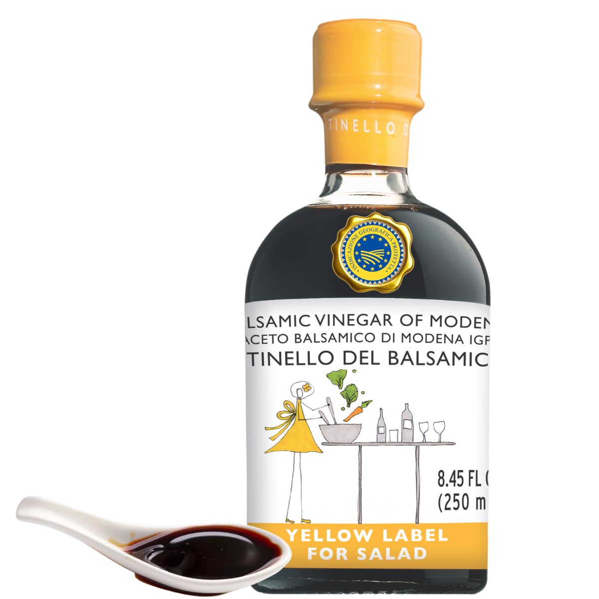 Bottle of balsamic vinegar with a yellow label on a white background