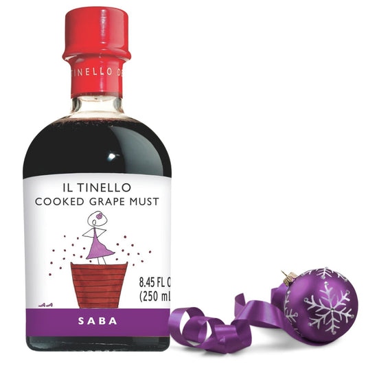 Bottle of Il Tinello Cooked Grape Must with a decorative purple ornament on a white background