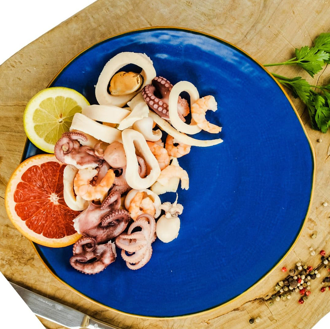 Close-up of Italian mixed seafood salad with octopus, shrimp, and mussels