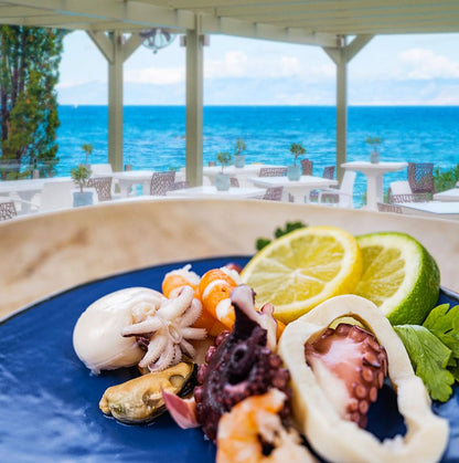 Italian seafood salad served Mediterranean style with fresh lemon and herbs