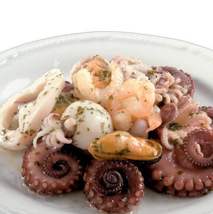 Italian seafood salad featuring octopus, shrimp, squid, and mussels
