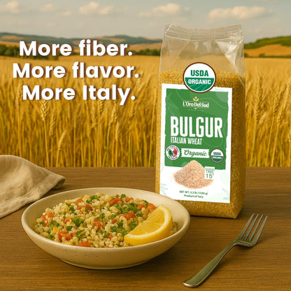 L’Oro Del Sud Organic Italian Bulgur Wheat 3.3 lb bag on a wooden table beside a bowl of bulgur salad with vegetables and lemon wedge, wheat field in the background with text “More fiber. More flavor. More Italy