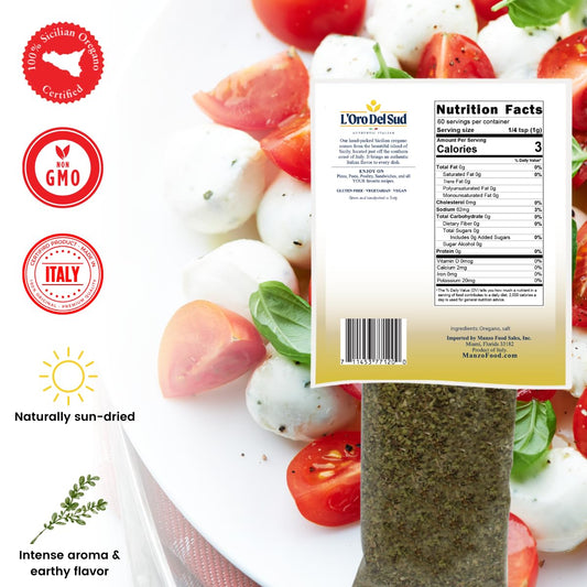Back view of L'Oro Del Sud Dried Sicilian Oregano 2.11 oz (60g) in resealable bag, showing nutrition facts, certifications (Non-GMO, Italian Certified, 100% Sicilian Oregano), and fresh mozzarella tomato salad background.