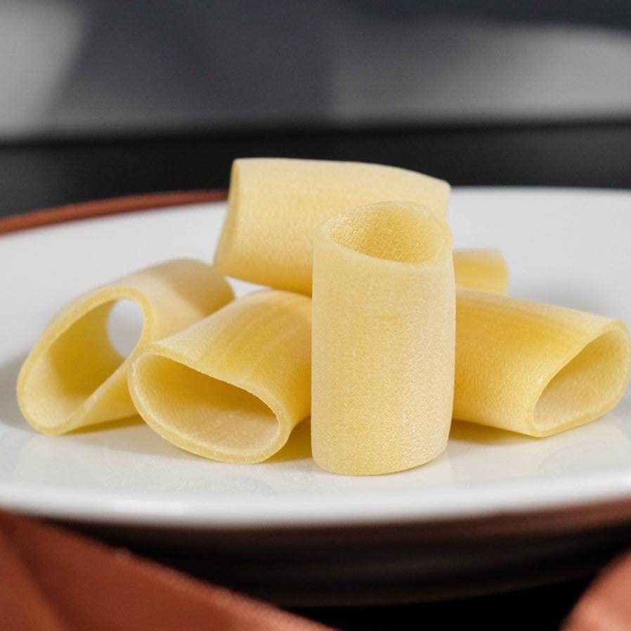 Marulo Paccheri homemade artisan pasta, 500g. Authentic Italian bronze-cut pasta made from 100% durum wheat semolina, hand-packed in a luxury brown box with a clear window showcasing the large tubular pasta shape.