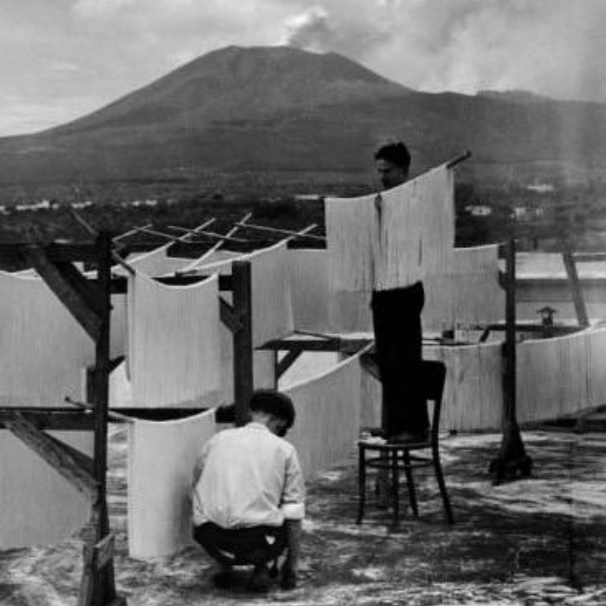 Historic pasta drying in Torre Annunziata with Mount Vesuvius in the background