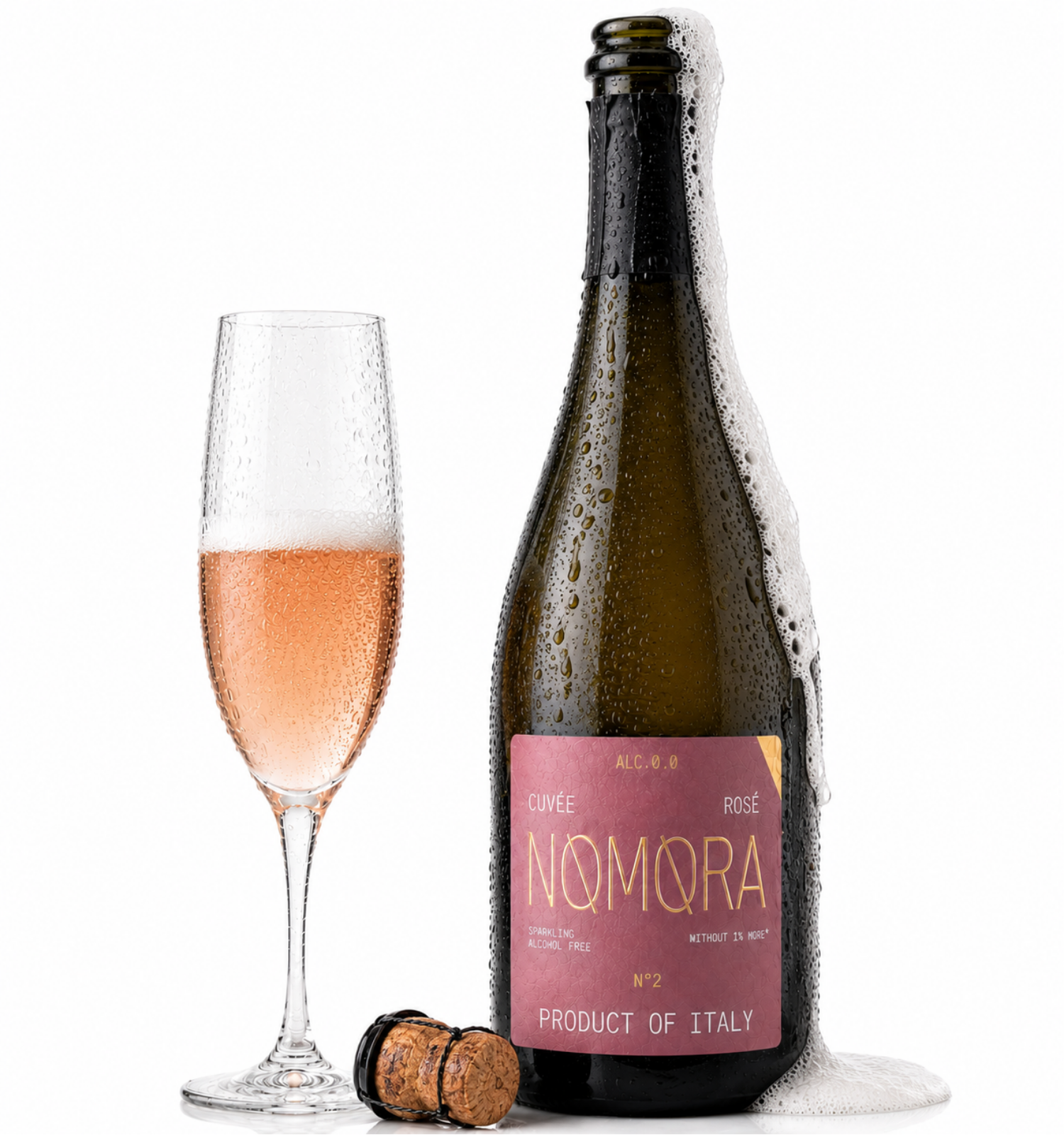 A bottle of Nomora coffee-spiced rosé sparkling wine stands next to a filled champagne flute with pink bubbly wine, with a cork on a white background.