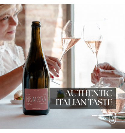A bottle of Nomora sparkling wine by Il Vino Italiano is shown on a table in a bright indoor setting, with a woman and hands holding champagne glasses in the background. A text overlay reads 'AUTHENTIC ITALIAN TASTE'.