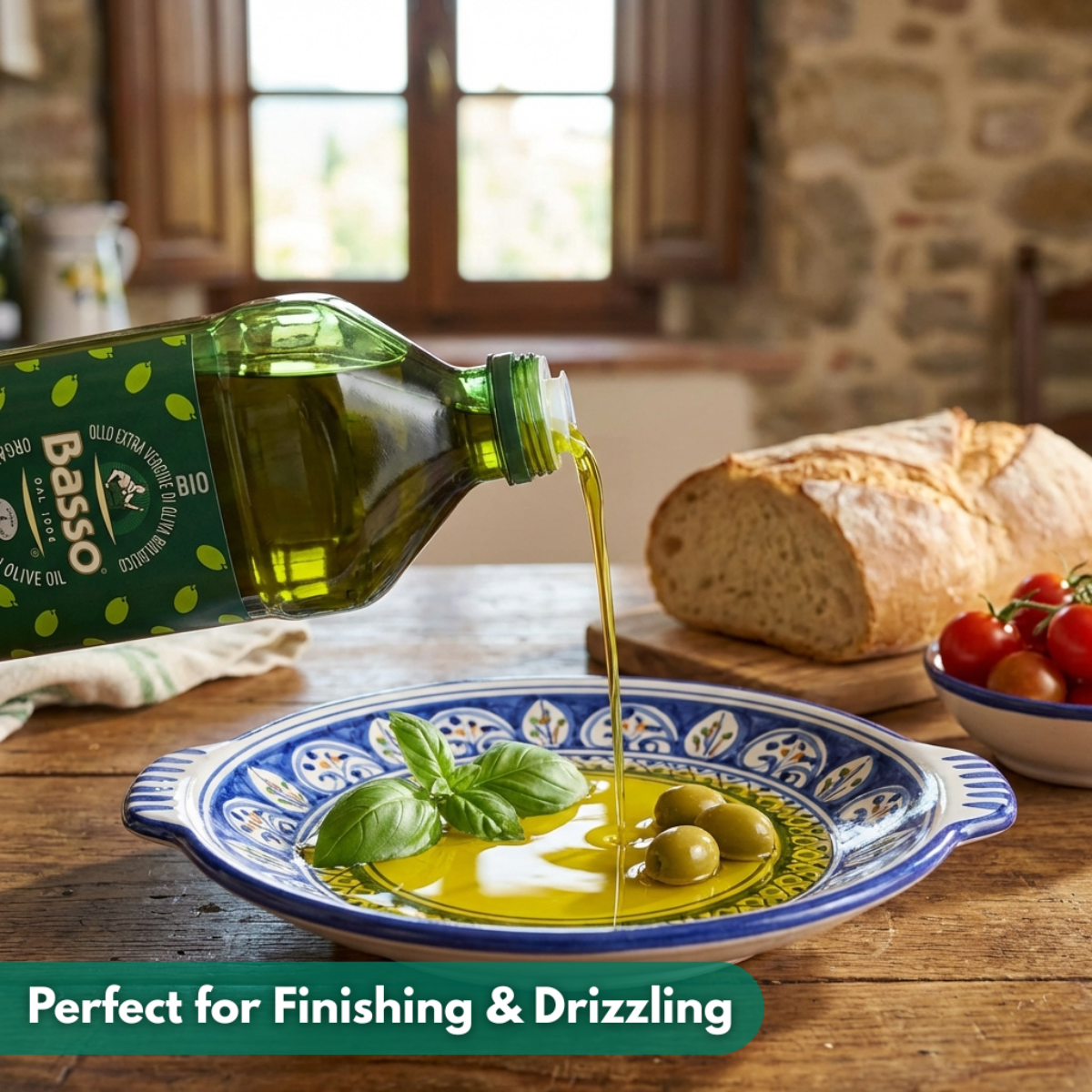 Basso olive oil being poured onto a plate with bread and tomatoes in the background