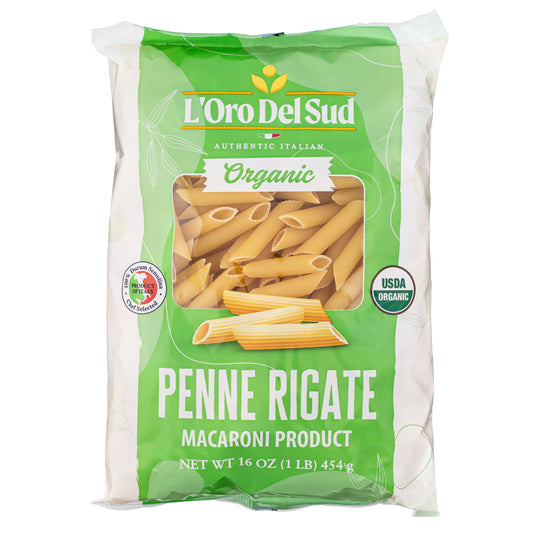 A package of L'Oro Del Sud Organic Penne Rigate Pasta showing the pasta inside the package with a green label, indicating it is a macaroni product and highlighting its organic certification.