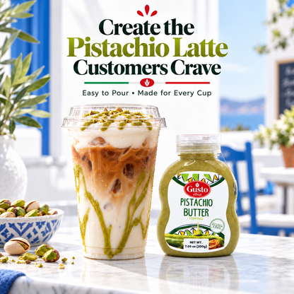 A glass cup of iced latte topped with green pistachio sauce and crushed pistachios stands on a marble counter beside a bottle of Gusto Pistachio Butter, with promotional text above and a bright outdoor patio background.