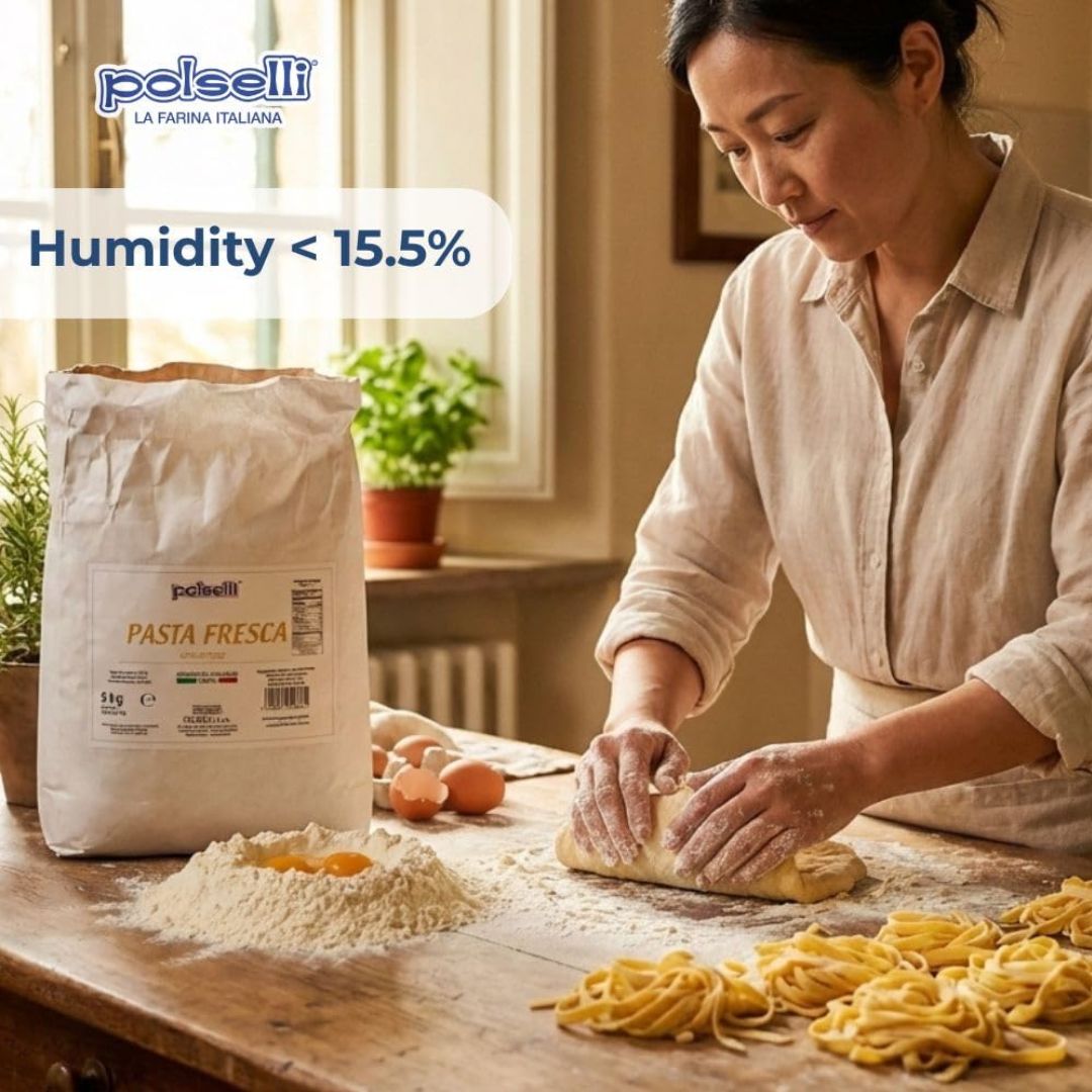 Woman making pasta with polselli pasta fresca on a wooden table.
