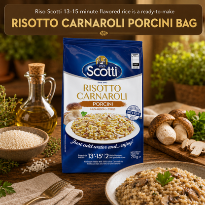 A bag of Riso Scotti Risotto Carnaroli Porcini mushrooms and rice stands on a wooden table in a styled kitchen scene with mushrooms, herbs, a bottle of oil, and a bowl of prepared rice. A brown banner at the top reads 'RISOTTO CARNAROLI PORCINI BAG'.