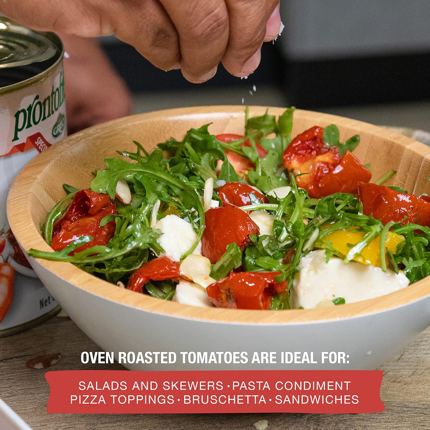 Fresh salad topped with semi-dried oven roasted tomatoes in oil.