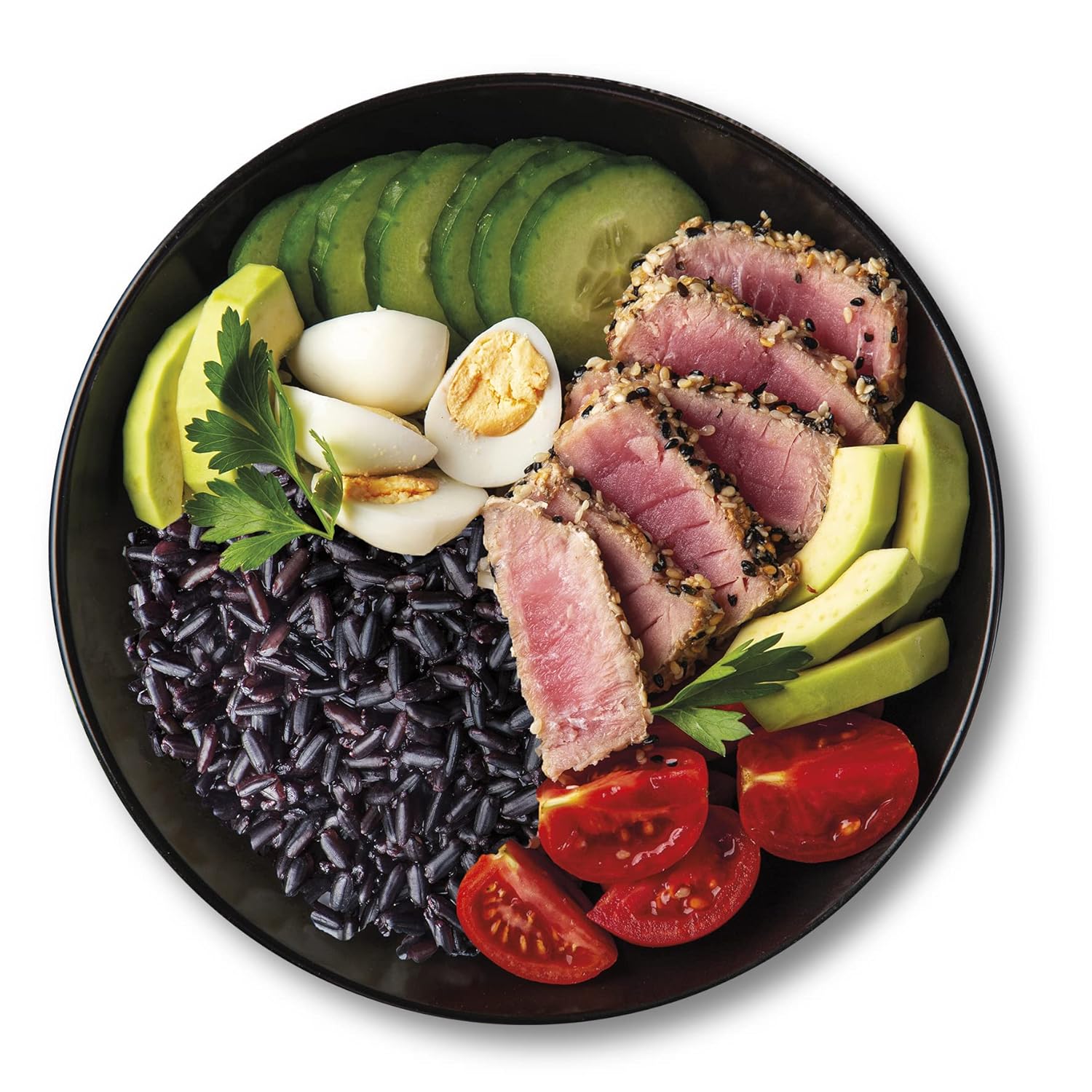 Plated dish with black purple rice, sliced beef, avocado, tomatoes, and boiled eggs on a black plate.