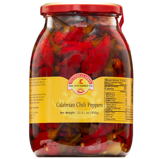 Jar of TuttoCalabria Calabrian chili peppers with a red lid on a white background