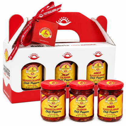 Set of sliced calabrian chili peppers in jars with a branded box on a white background