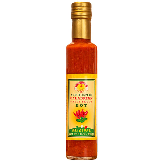 Bottle of Authentic Calabrian chili sauce with a gold cap on a white background