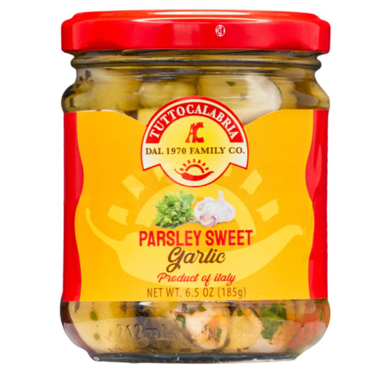 Jar of Tutto Calabria Parsley Sweet Garlic, product of Italy, 6.5 oz (185g), featuring whole garlic cloves marinated with parsley in oil
