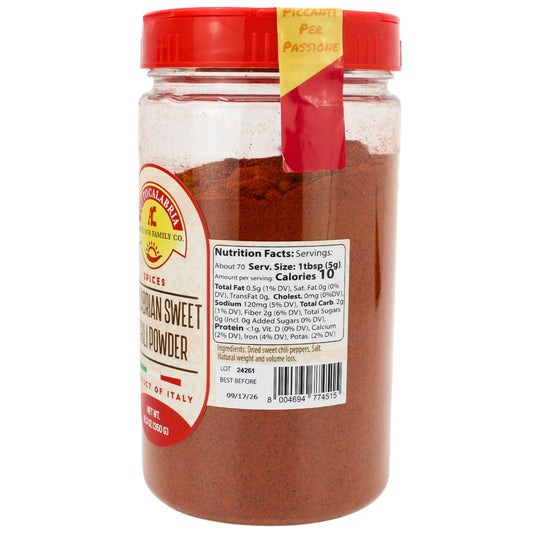 Jar of Italian sweet paprika with a red lid on a white background
